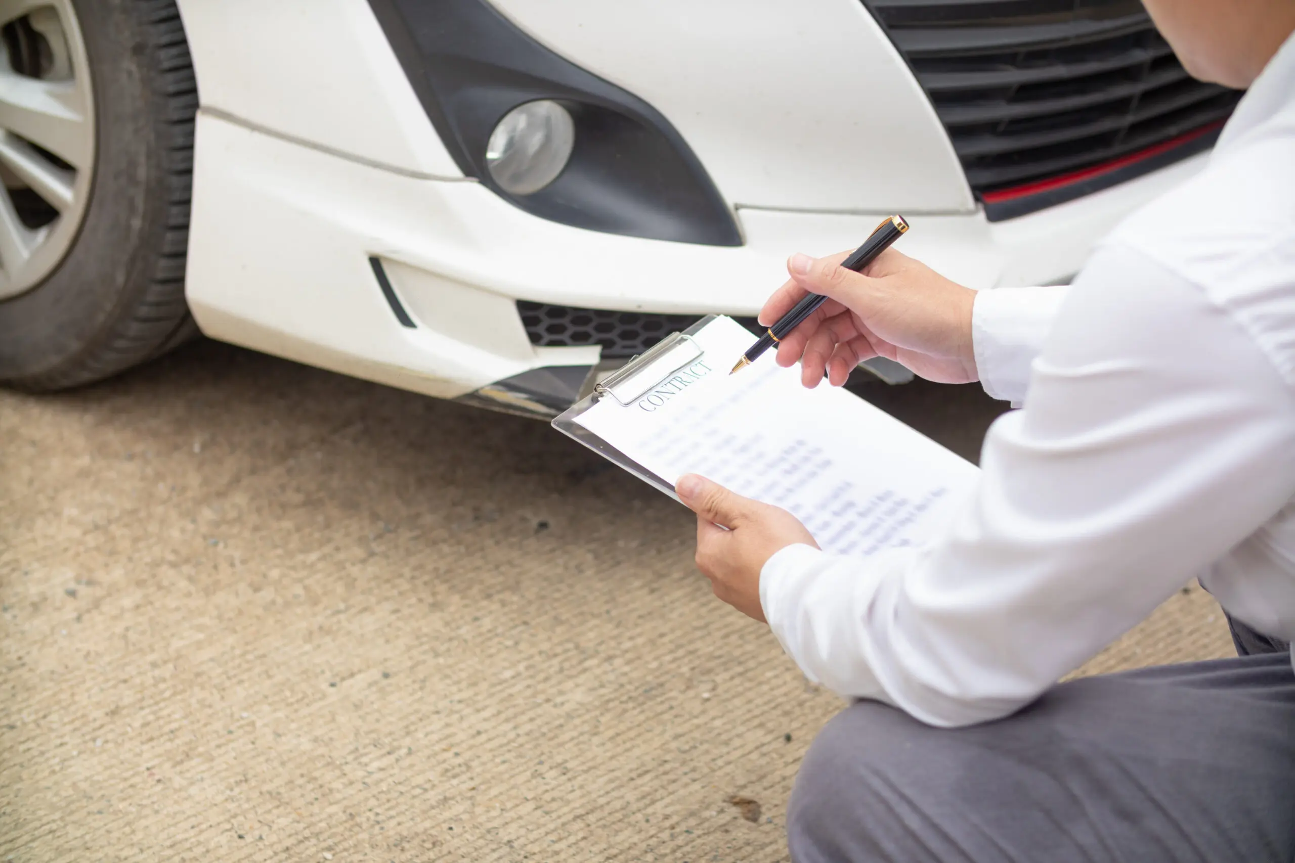 Insurance agents meet with customers when accidents occur to inspect damage and document insurance claims expeditiously. concept of car insurance agents to urgently inspect damage for customers.